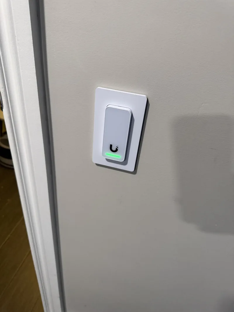 Installed access control reader on a doorway